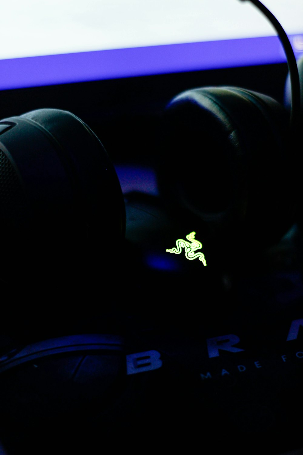 a pair of headphones sitting on top of a computer keyboard