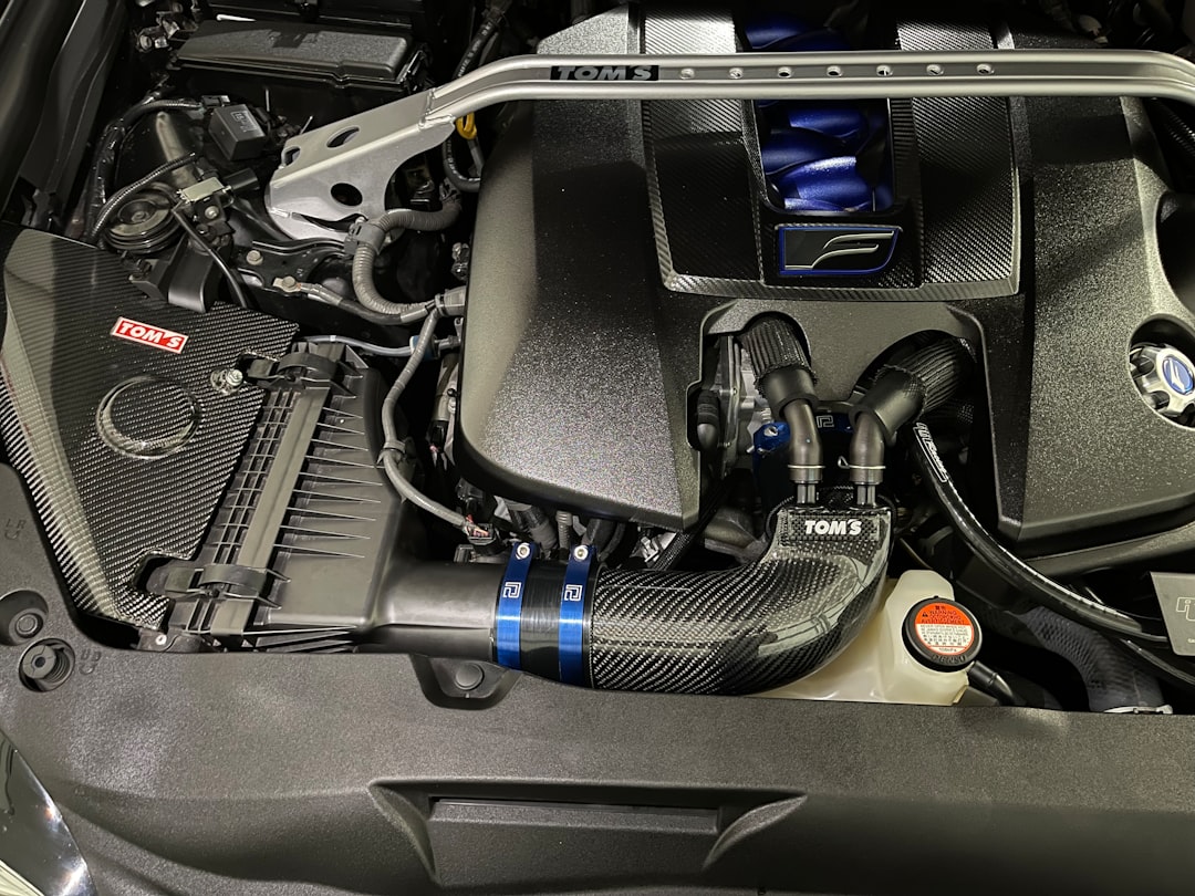 the engine compartment of a car with the hood up, Engine bay