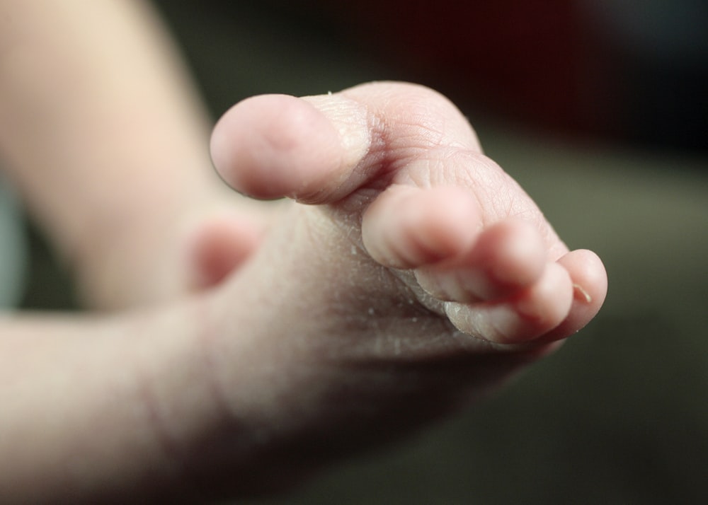 a close up of a person's foot with a blurry background