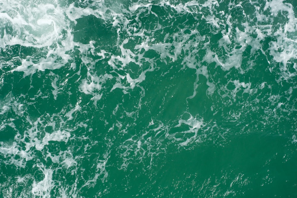 a view of the top of a wave in the ocean