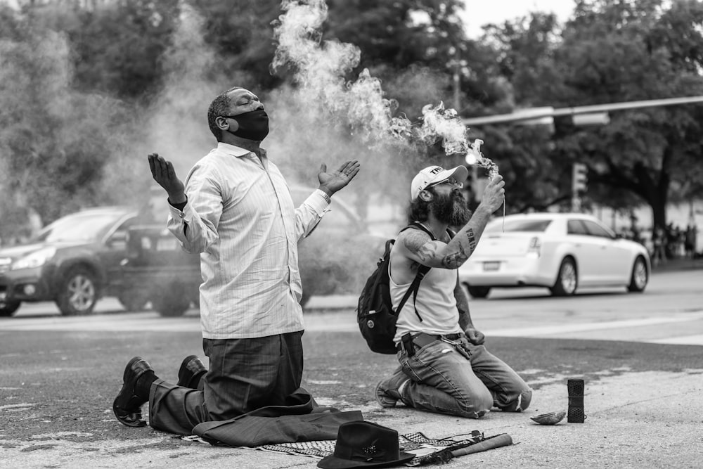 a couple of people that are sitting on the ground