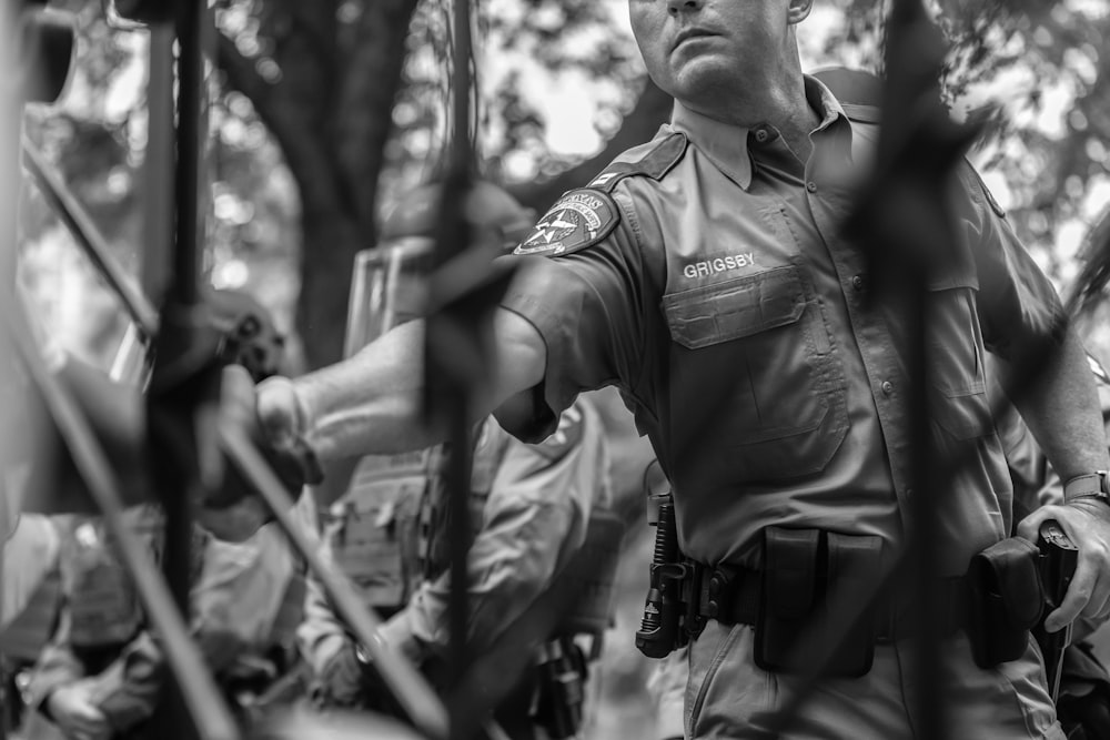 a black and white photo of a police officer
