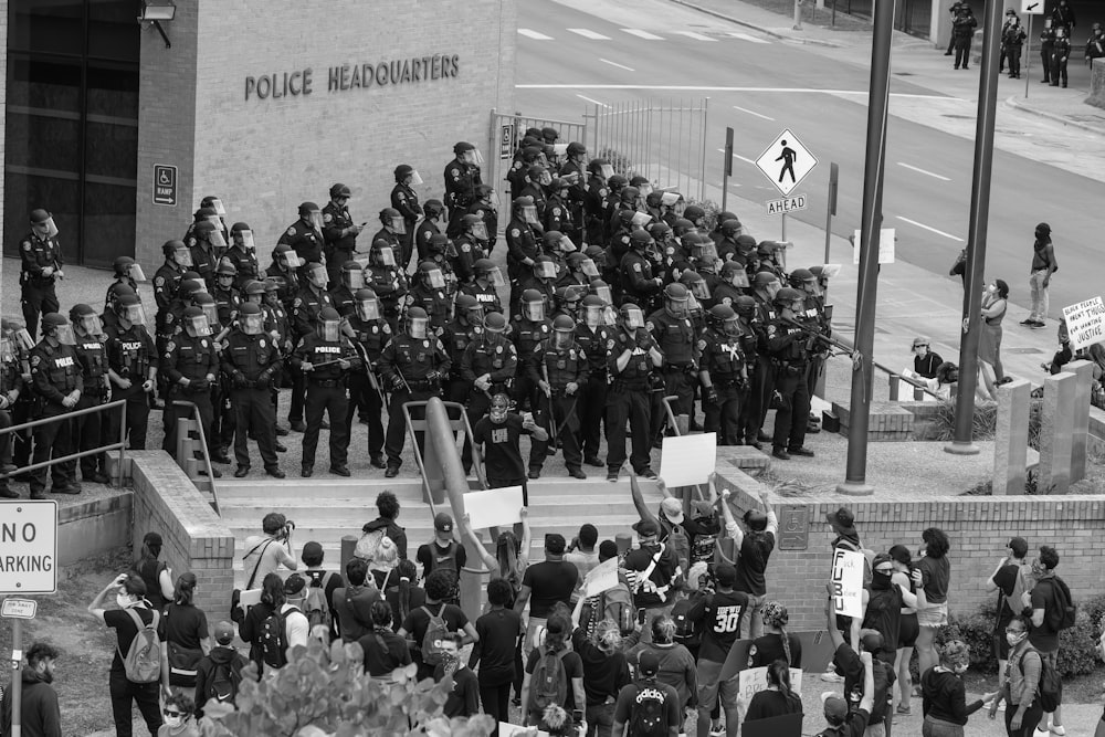 a group of police officers standing in front of a building