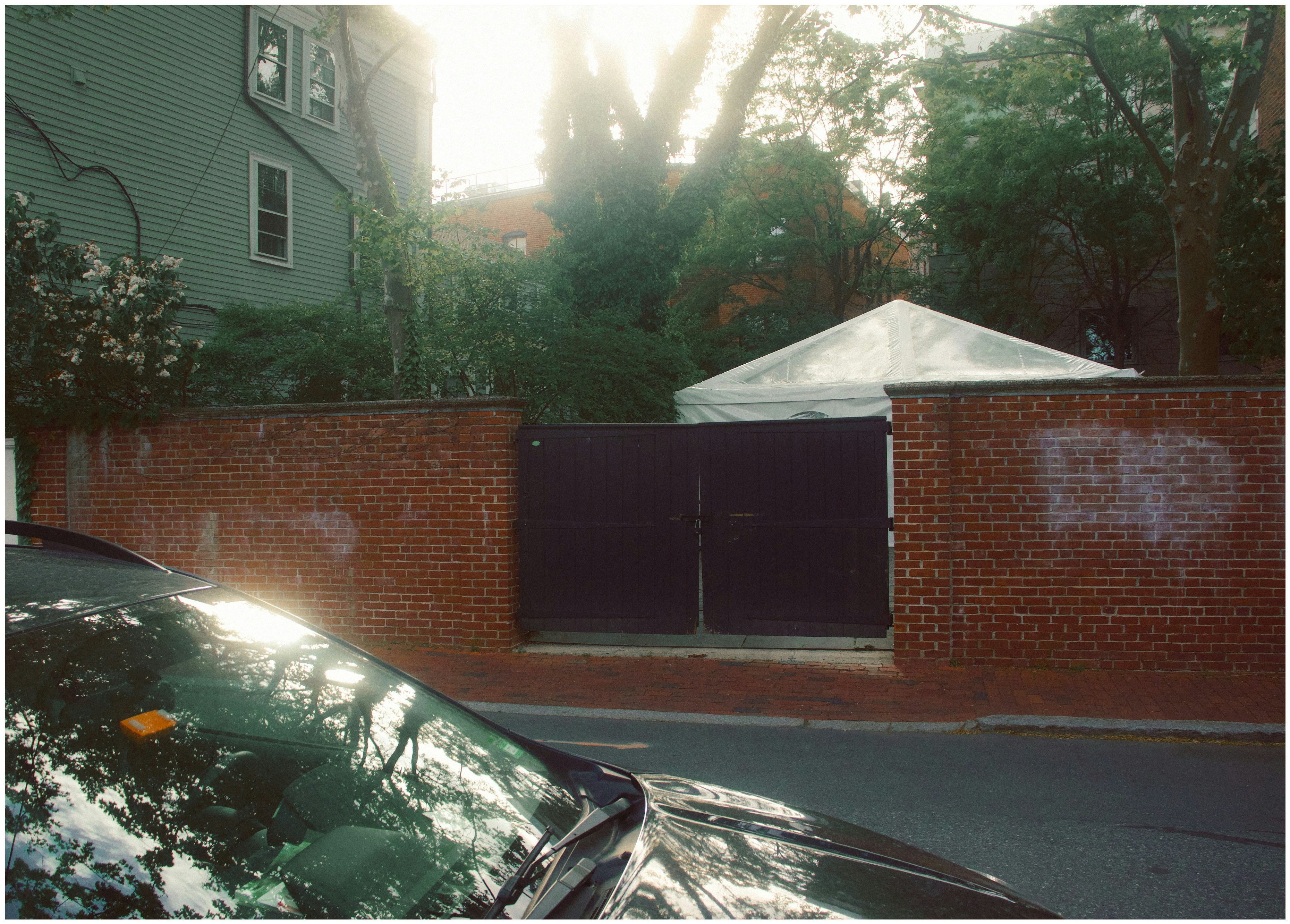 a car parked in front of a brick building