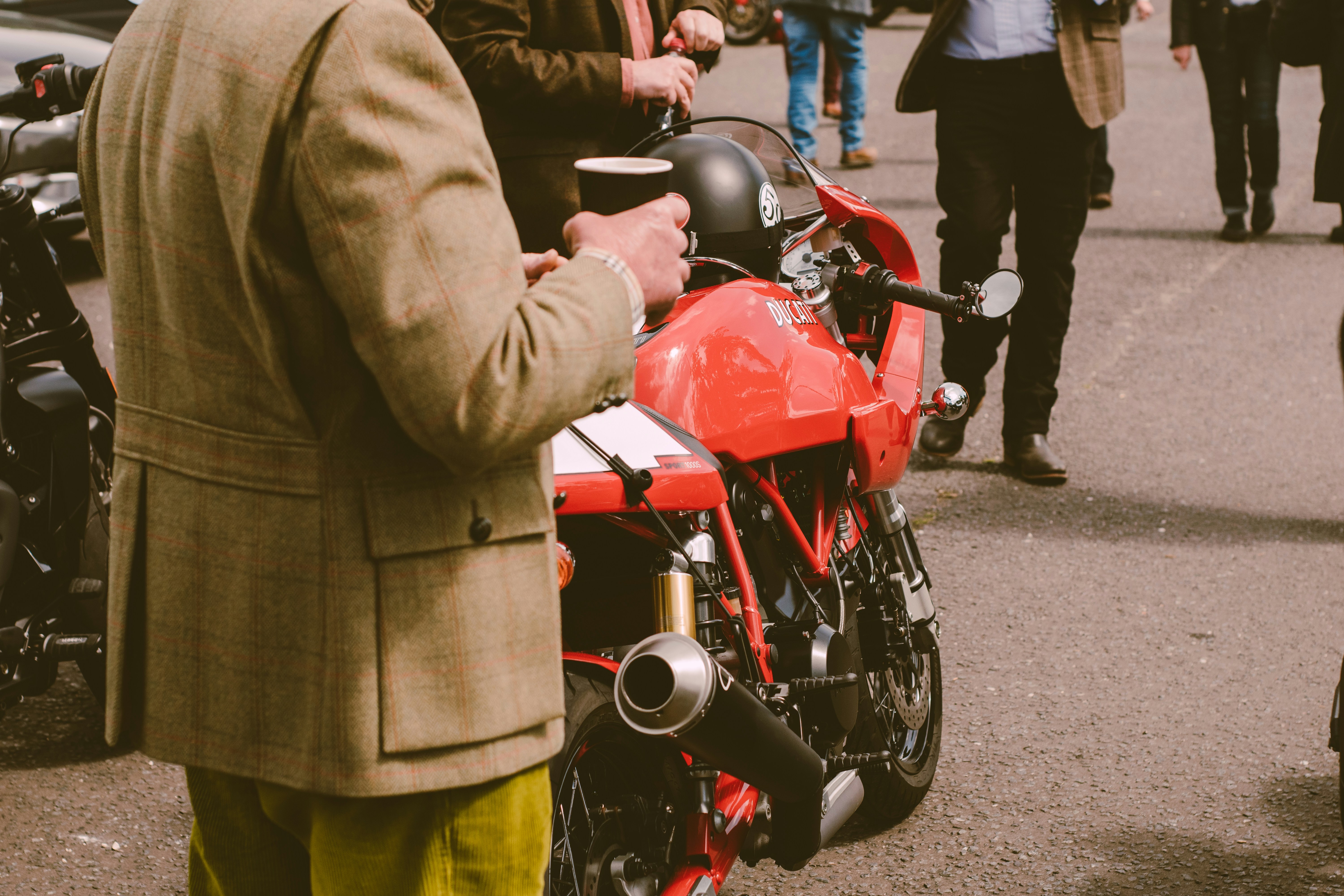 Professional motorcycle buyer standing next to a motorcycle ready for purchase