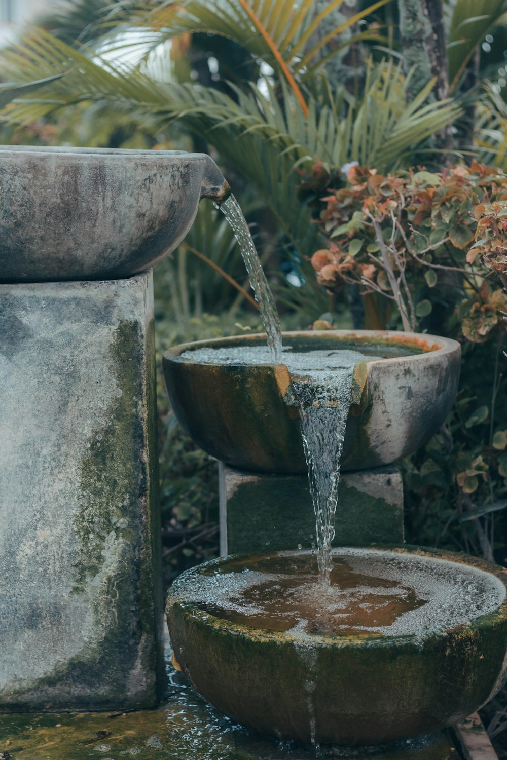 a fountain with water pouring out of it