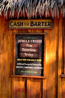 a sign on the side of a wooden building