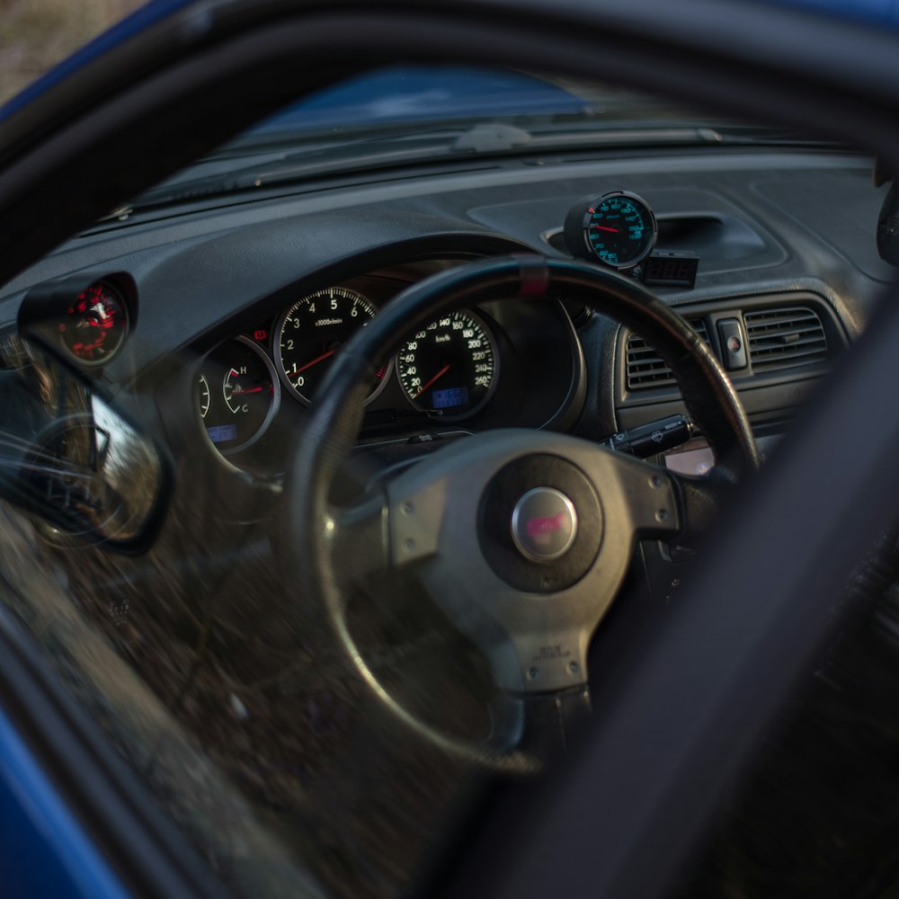 the dashboard of a car with a speedometer and gauges