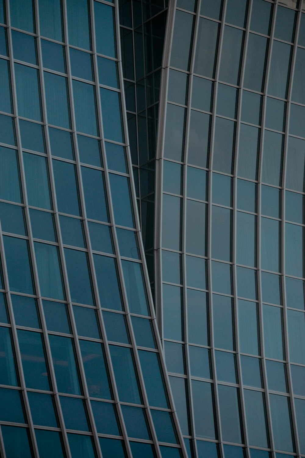 an airplane flying in the air near a building