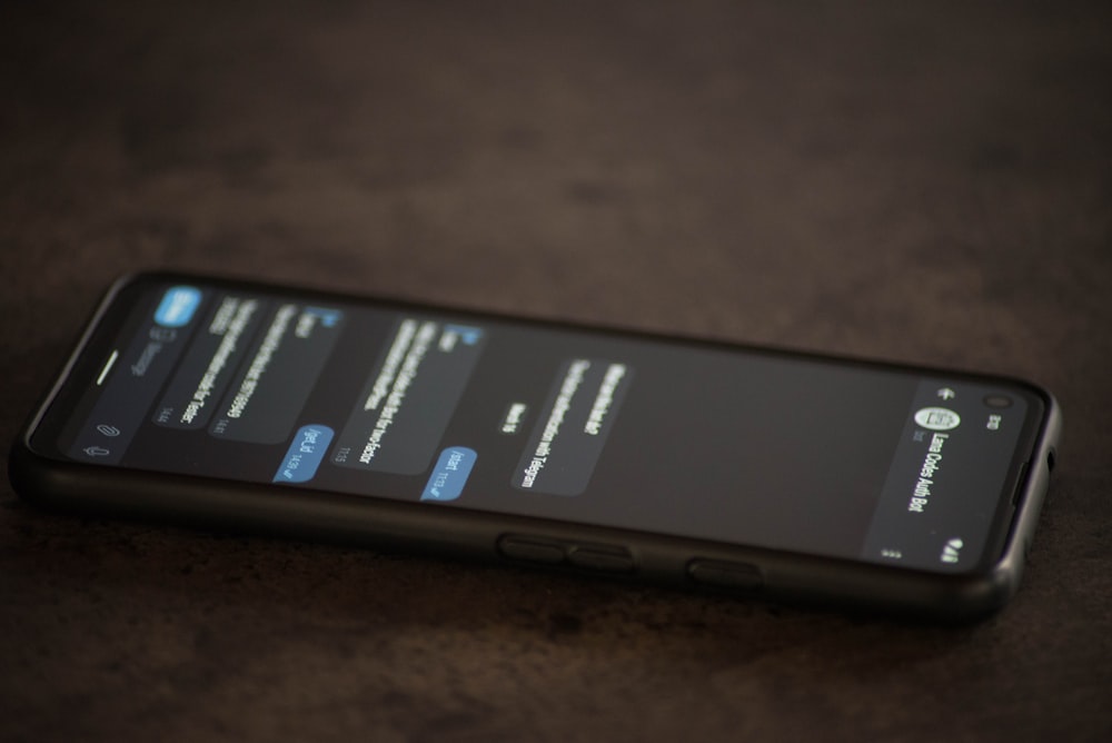 a close up of a cell phone on a table