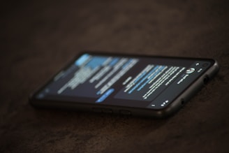 a close up of a cell phone on a table