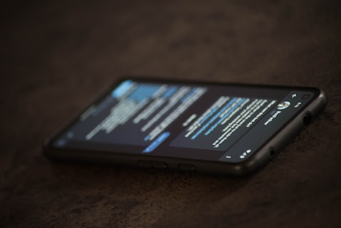 a close up of a cell phone on a table