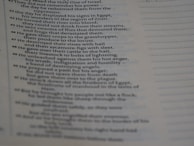 The image features a close-up view of a page from a religious text, possibly a Bible, displaying a number of verses arranged in a column. The text appears to be discussing historical events and divine actions.