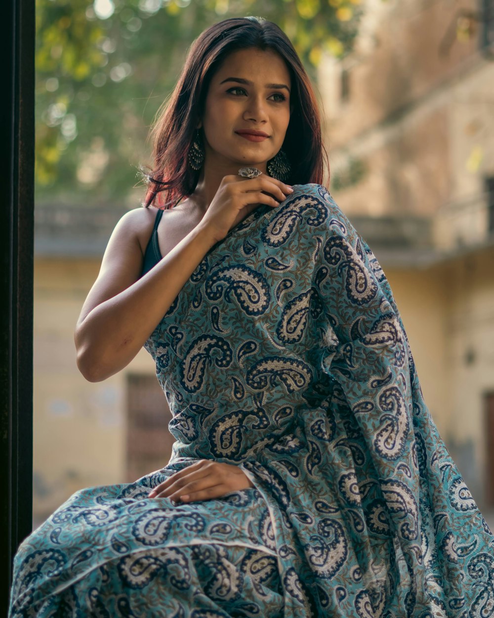 a woman in a blue dress posing for a picture