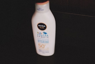 a bottle of sunscreen sitting on a table