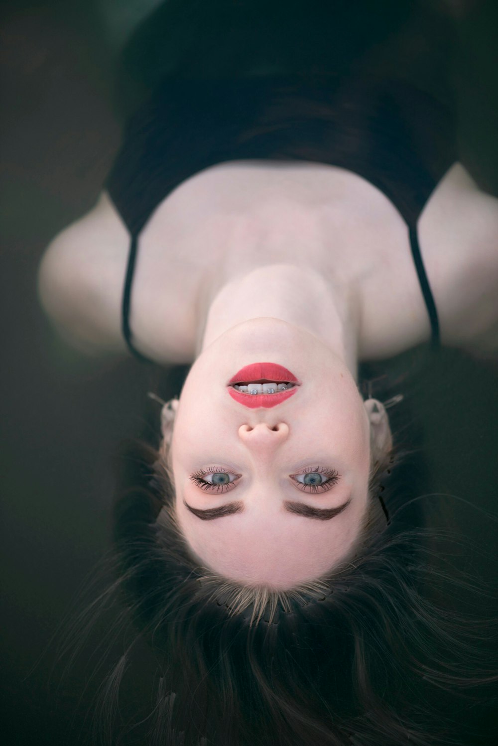 a woman is upside down in the water