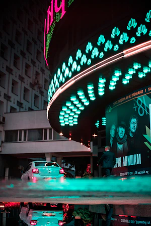 People enjoying cocktails in a dimly lit speakeasy bar, a refined Gangnam bar 2026