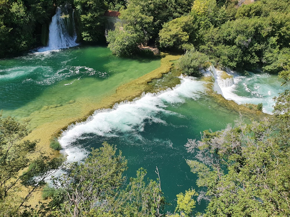 a river with a waterfall in the middle of it