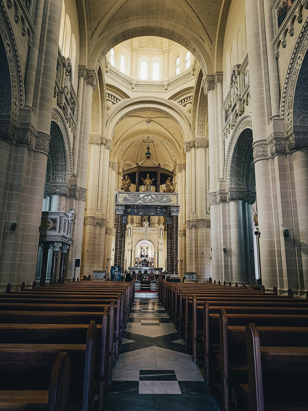 the inside of a large church with pews