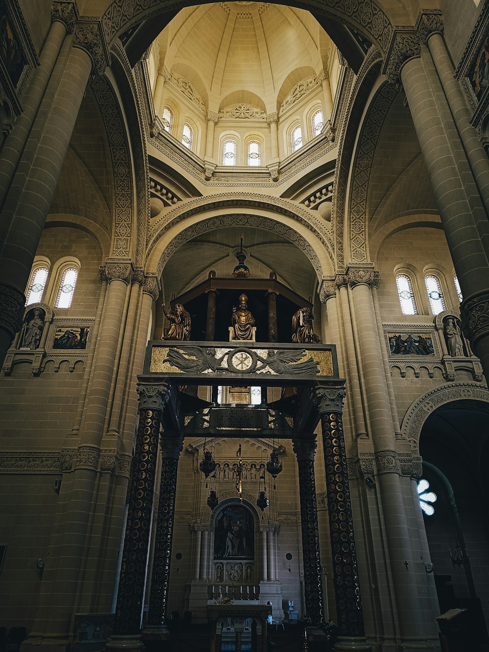 a large cathedral with a clock on the front of it