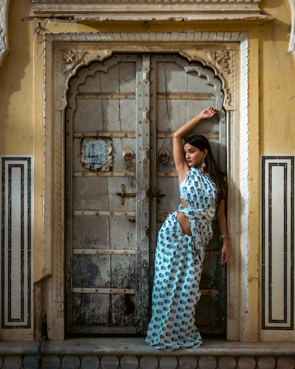 a woman standing in front of a door