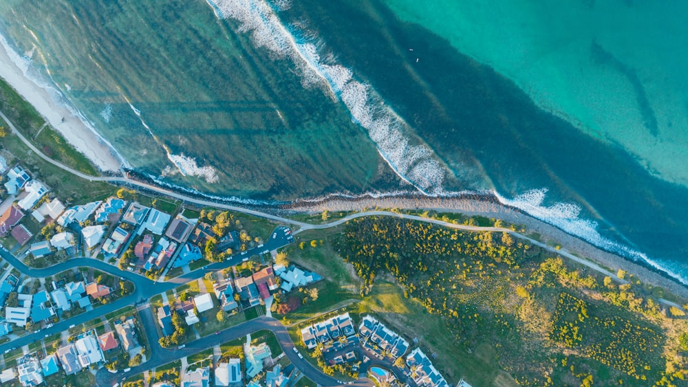 an aerial view of a beach and a city