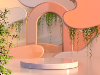 A sleek, contemporary event backdrop featuring geometric shapes and subtle greenery accents.