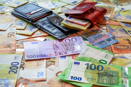 a pile of money sitting on top of a table