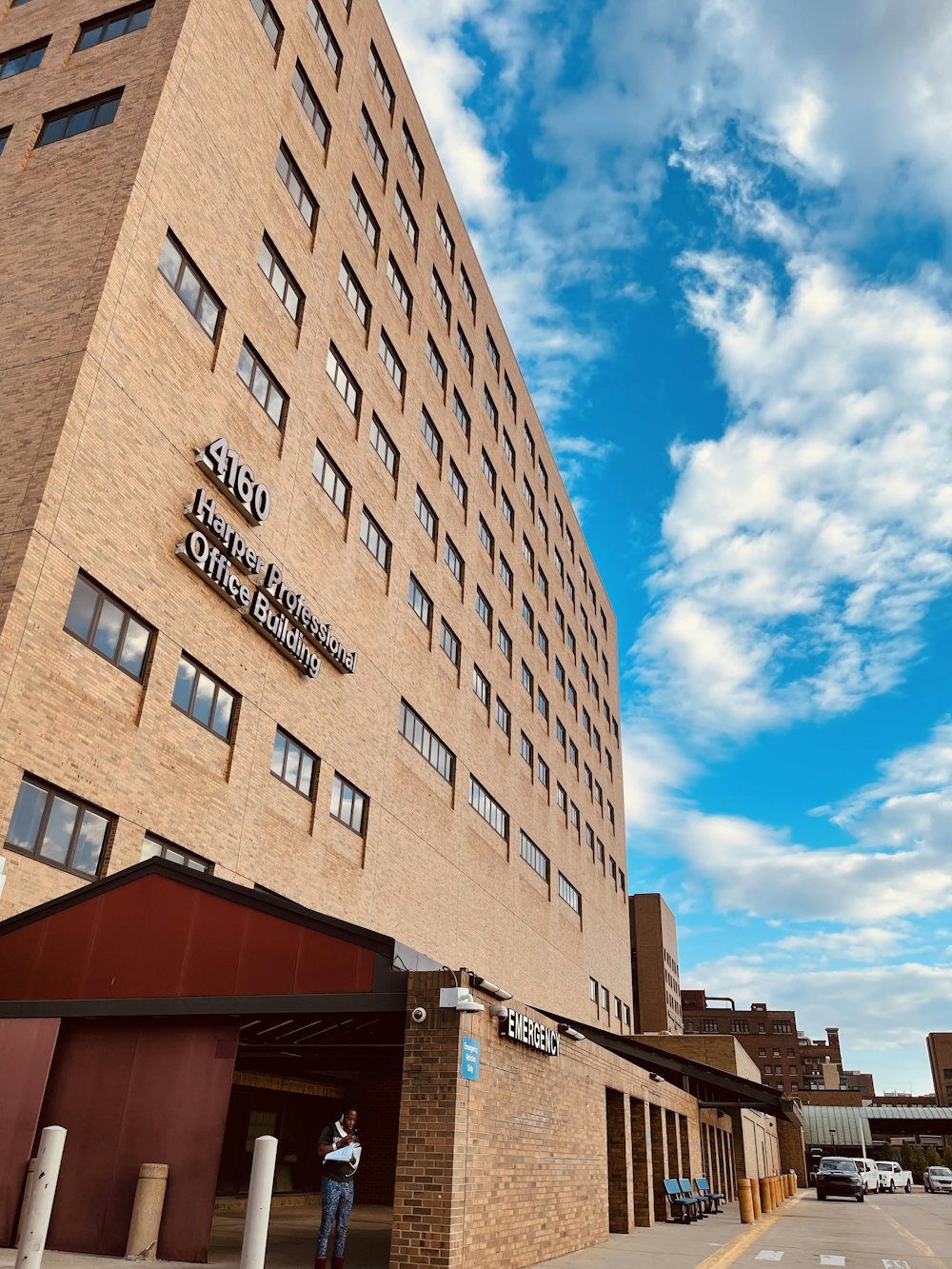 a tall brick building with a sky background