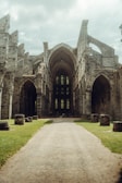a large stone building with arches and arches