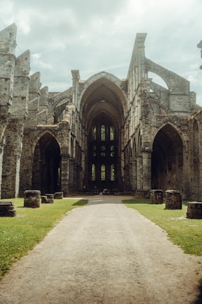 a large stone building with arches and arches