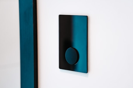 Electrician installing smart switches in a modern home setting.