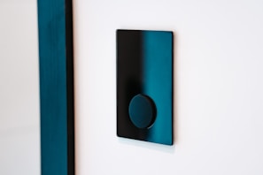 Close-up of a modern smart wall switch installation in a hotel room