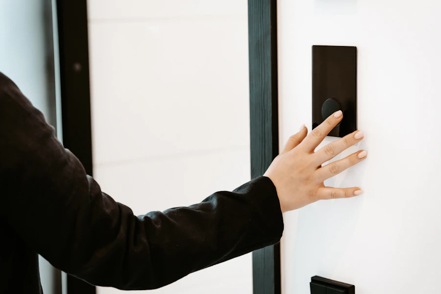 Technician working on door hardware during a smart lock installation