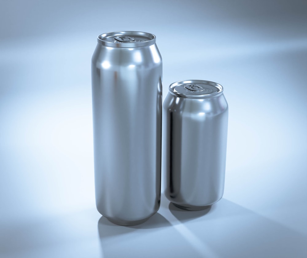 a couple of silver cans sitting next to each other