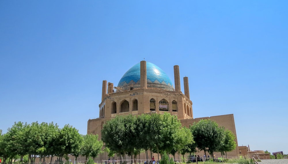 a large building with a blue dome on top of it