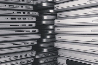 a room filled with lots of laptop computers