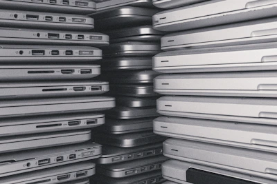 a room filled with lots of laptop computers