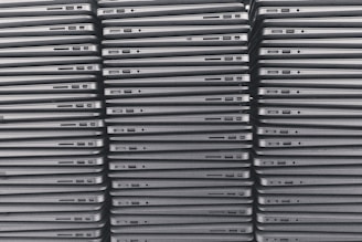 a stack of laptops sitting on top of each other