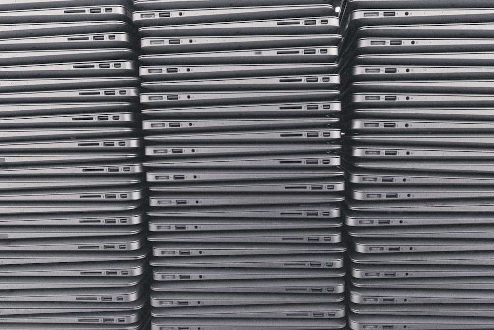 a stack of laptops sitting on top of each other