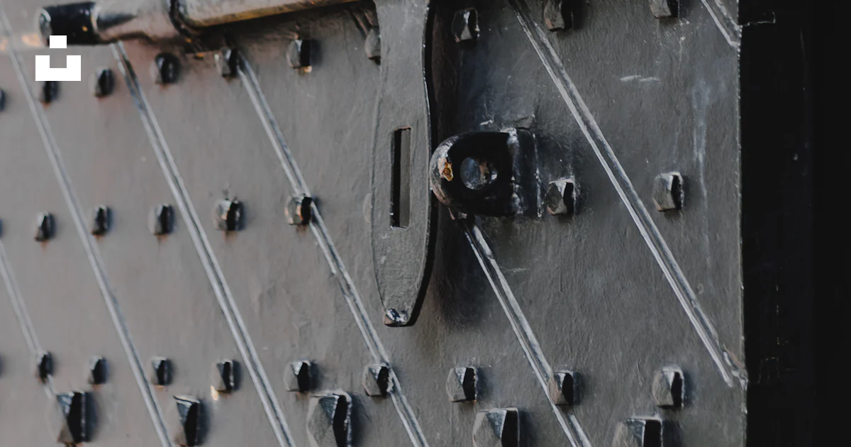 A close up of a metal door with rivets photo – Free Grey Image on Unsplash