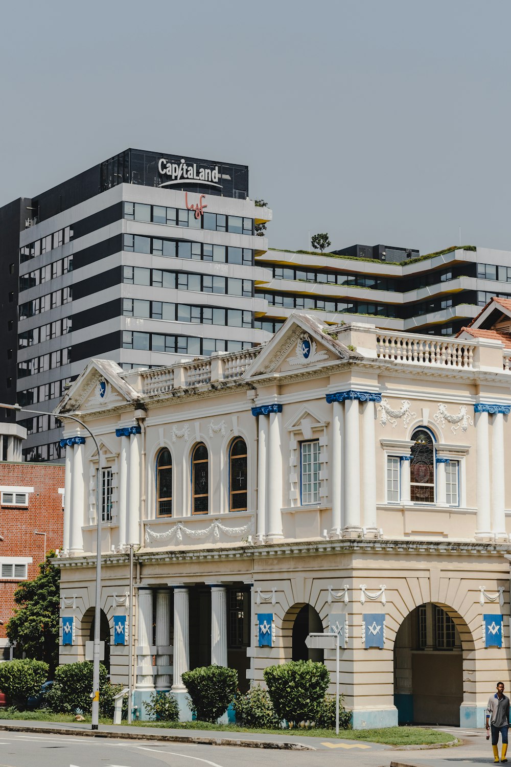 a large white building sitting next to a tall building