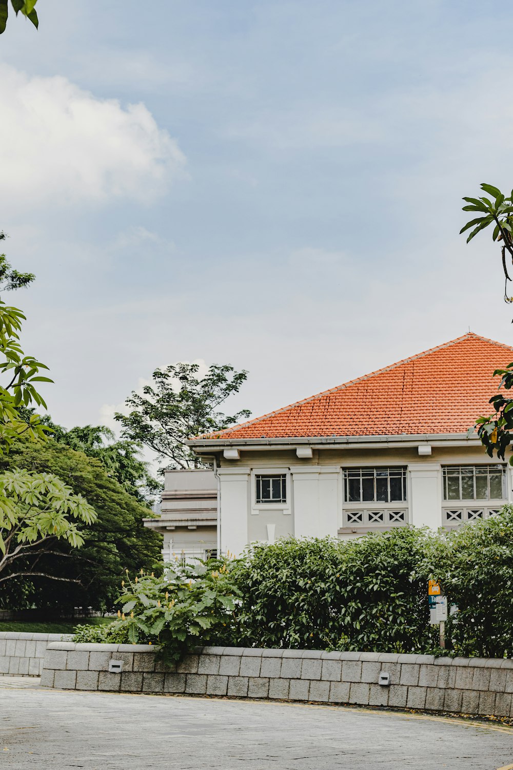 a white house with a red tiled roof