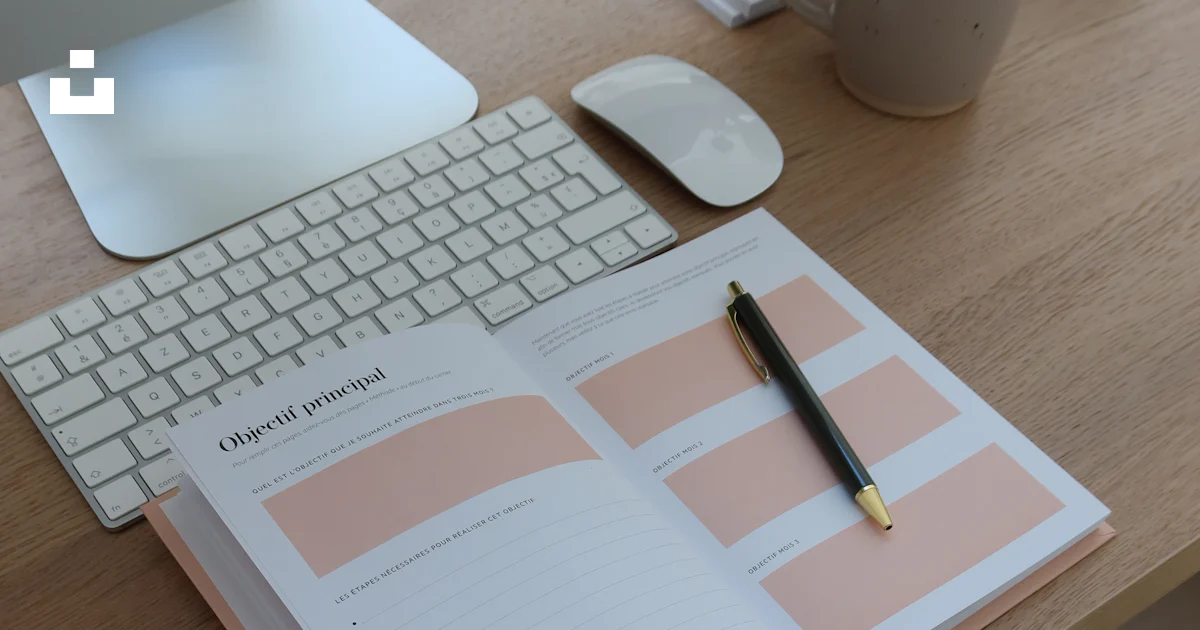 An open notebook sitting on top of a wooden desk photo – Free Business ...