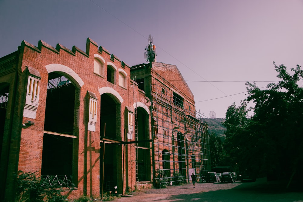 a brick building with scaffolding on the side of it