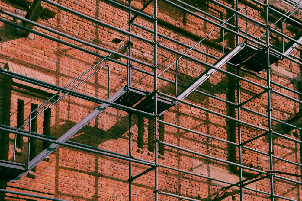 a brick building with scaffolding around it