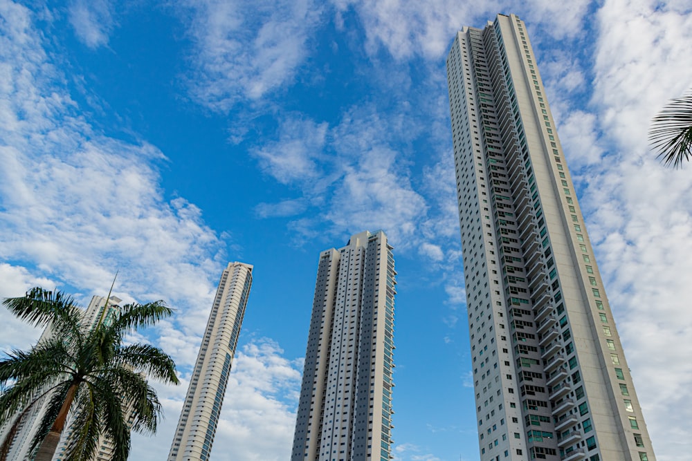 a couple of tall buildings sitting next to each other