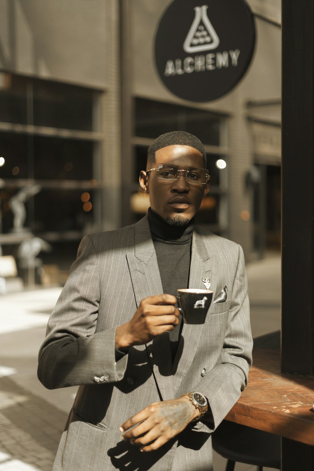 a man in a suit holding a cell phone