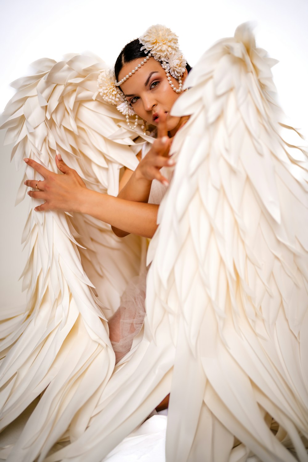 a woman dressed in a white angel costume
