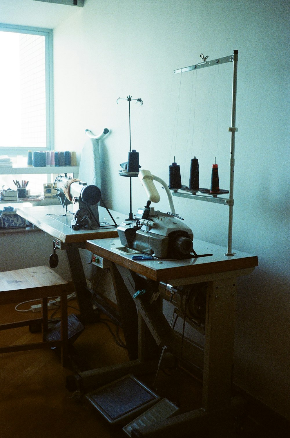 a sewing machine sitting on top of a wooden table